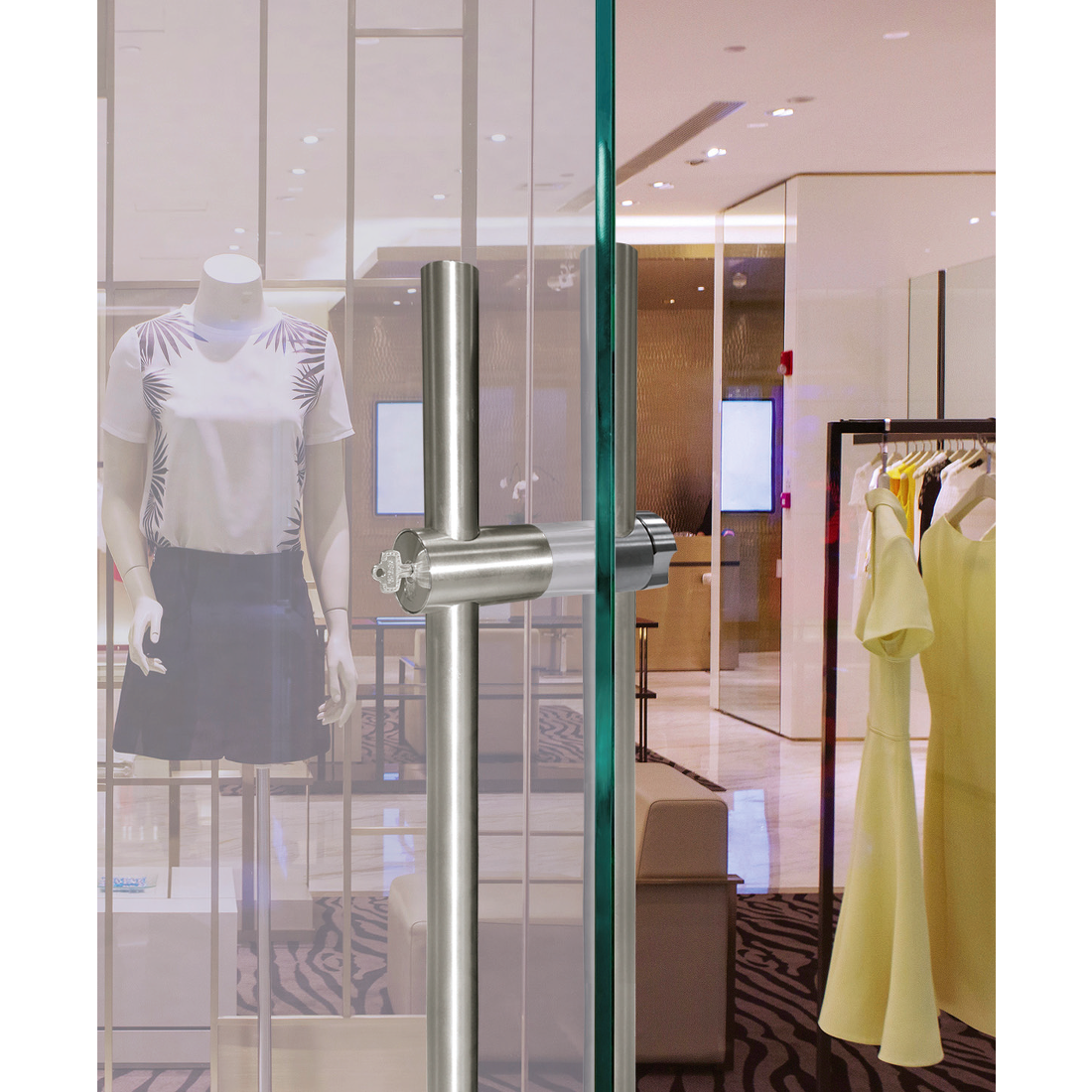 Locking ladder pull installed on glass door in shopping mall