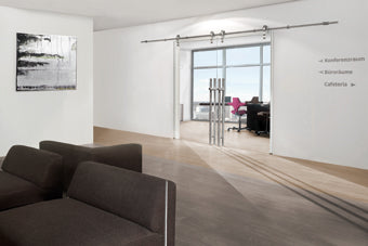 Locking ladder pull and sliding door hardware installed on double glass door