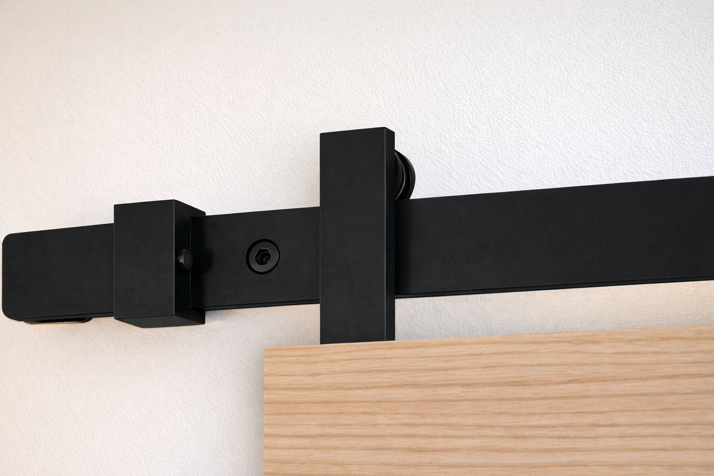 sliding door hardware Runway in black with top mounted trolley installed on wooden door